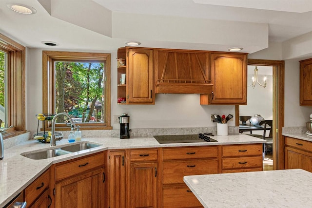 N1124 County Rd E, Waupaca, WI 54981 - kitchen featuring black electric cooktop, a sink, brown cabinets, and recessed lighting