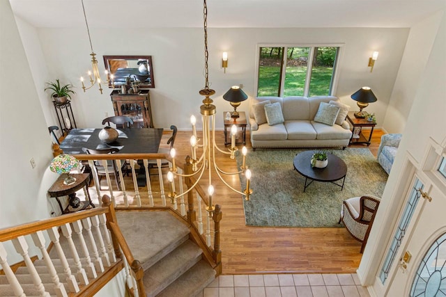 N1124 County Rd E, Waupaca, WI 54981 - living room with a chandelier, tile patterned flooring, and stairs