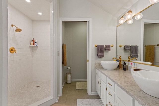 N1124 County Rd E, Waupaca, WI 54981 - bathroom featuring tile patterned floors, double vanity, a tile shower, recessed lighting, and vaulted ceiling