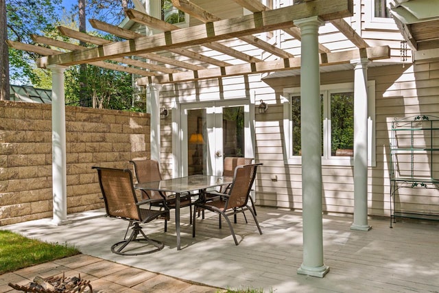 N1124 County Rd E, Waupaca, WI 54981 - view of patio / terrace with outdoor dining space, a pergola, french doors, and a deck