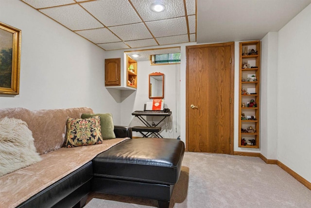 N1124 County Rd E, Waupaca, WI 54981 - living area featuring light colored carpet, baseboards, and a paneled ceiling