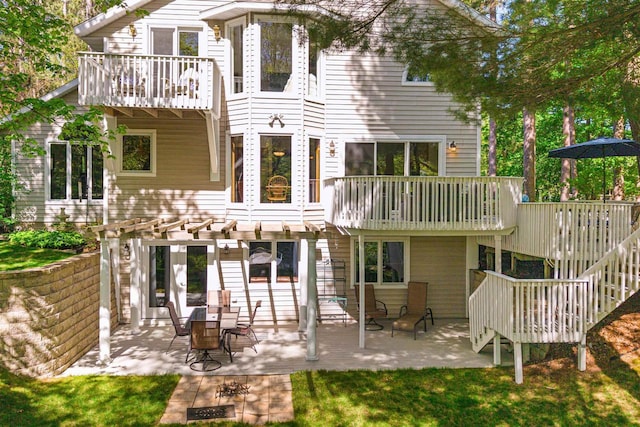 N1124 County Rd E, Waupaca, WI 54981 - back of house with a balcony, a pergola, and a patio