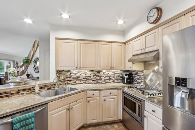 14048 W Waters Edge Trl, New Berlin, WI 53151 - kitchen featuring appliances with stainless steel finishes, a sink, under cabinet range hood, tasteful backsplash, and light brown cabinetry