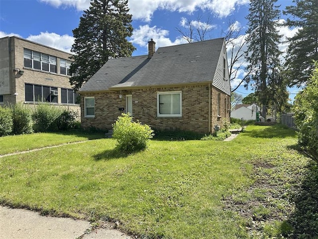5936 N 35th St, Milwaukee, WI 53209 - view of front of home with brick siding, a chimney, and a front lawn