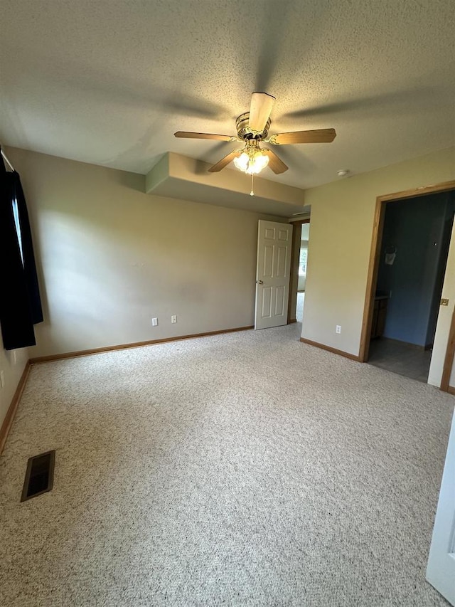 433 Eberlein Ct, Mauston, WI 53948 - unfurnished bedroom featuring a textured ceiling, carpet floors, baseboards, and a ceiling fan