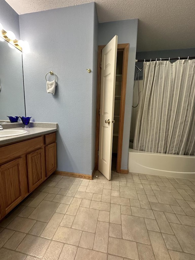 433 Eberlein Ct, Mauston, WI 53948 - full bath featuring vanity, shower / tub combo, a textured ceiling, and baseboards