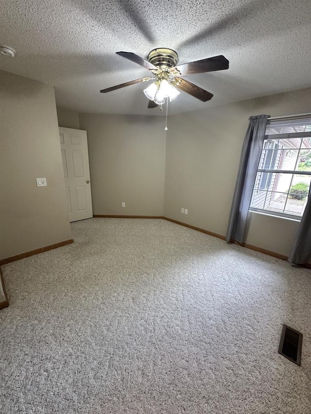 433 Eberlein Ct, Mauston, WI 53948 - unfurnished room featuring a ceiling fan, carpet, baseboards, a textured ceiling, and a smoke detector