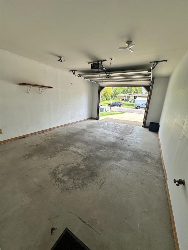433 Eberlein Ct, Mauston, WI 53948 - garage featuring a garage door opener and baseboards