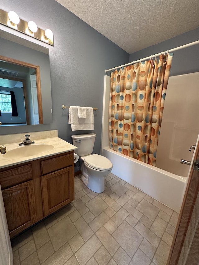 433 Eberlein Ct, Mauston, WI 53948 - full bathroom featuring vanity, shower / bath combo, toilet, a textured ceiling, and stone finish flooring