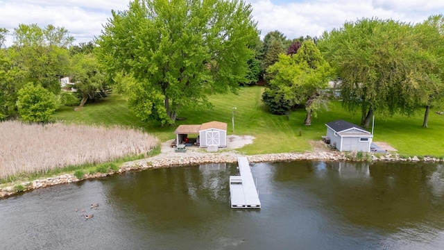 10029 W Spring Rd, Fox Lake, WI 53933 - dock area with a yard, a water view, and view of wooded area
