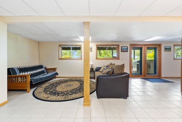 10029 W Spring Rd, Fox Lake, WI 53933 - living room with plenty of natural light, light tile patterned floors, and baseboards