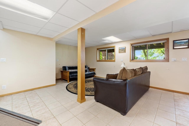 10029 W Spring Rd, Fox Lake, WI 53933 - living room with plenty of natural light, baseboards, light tile patterned floors, and a paneled ceiling