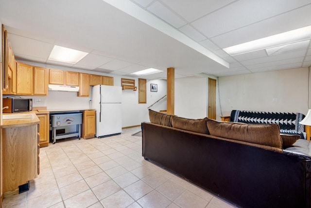 10029 W Spring Rd, Fox Lake, WI 53933 - living area featuring a drop ceiling, light tile patterned floors, and stairs
