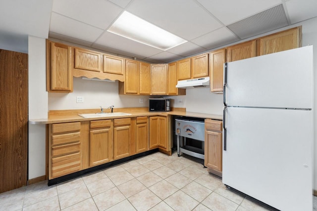10029 W Spring Rd, Fox Lake, WI 53933 - kitchen featuring freestanding refrigerator, under cabinet range hood, black microwave, light countertops, and a drop ceiling