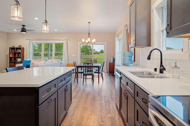 W4936 Battlestone Station Rd, La Crosse, WI 54601 - kitchen with a sink, dishwasher, light wood finished floors, plenty of natural light, and recessed lighting