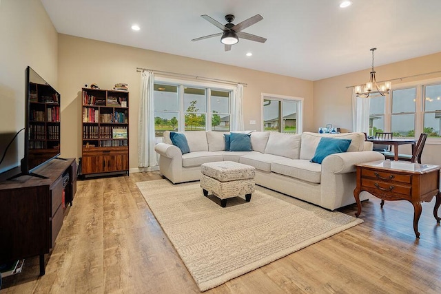 W4936 Battlestone Station Rd, La Crosse, WI 54601 - living room featuring a ceiling fan, a chandelier, light wood-style floors, and recessed lighting