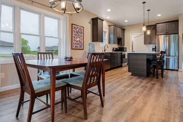 W4936 Battlestone Station Rd, La Crosse, WI 54601 - dining room with a chandelier, light wood-style floors, recessed lighting, and baseboards