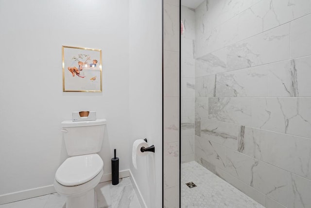 W4936 Battlestone Station Rd, La Crosse, WI 54601 - bathroom with marble finish flooring, baseboards, toilet, and tiled shower