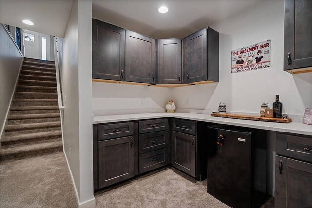 W4936 Battlestone Station Rd, La Crosse, WI 54601 - indoor dry bar featuring light colored carpet, stairs, and recessed lighting