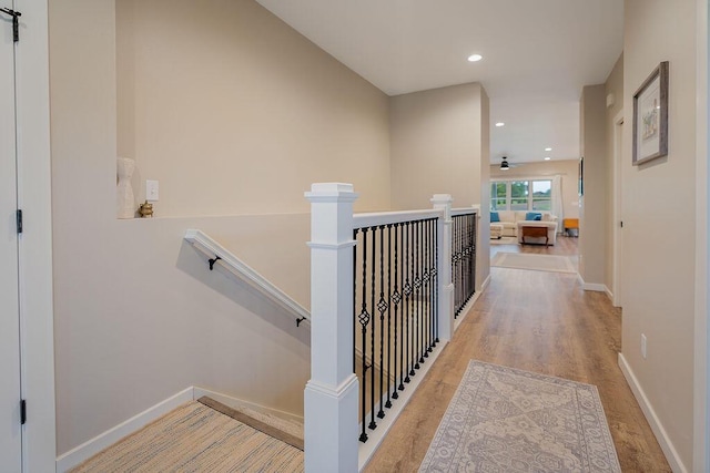 W4936 Battlestone Station Rd, La Crosse, WI 54601 - hall with an upstairs landing, wood finished floors, baseboards, and recessed lighting