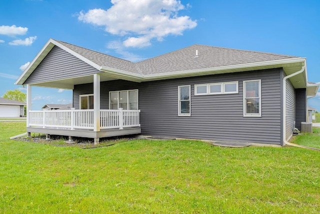 W4936 Battlestone Station Rd, La Crosse, WI 54601 - back of house featuring central AC unit, a yard, a wooden deck, and roof with shingles