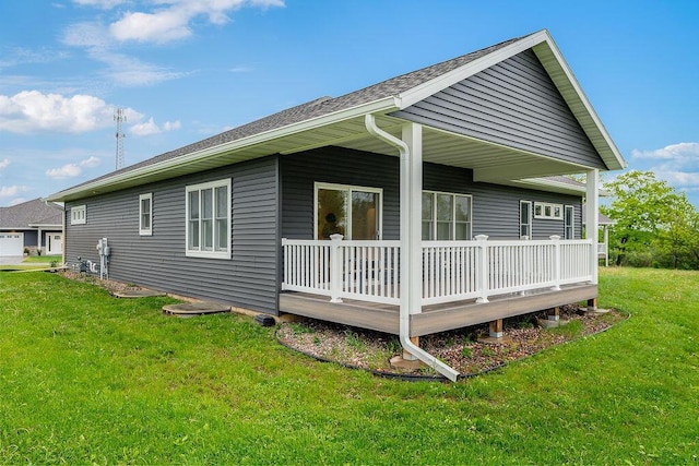 W4936 Battlestone Station Rd, La Crosse, WI 54601 - view of property exterior with a lawn and roof with shingles