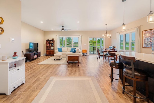 W4936 Battlestone Station Rd, La Crosse, WI 54601 - living area with light wood finished floors, a chandelier, ceiling fan, recessed lighting, and baseboards