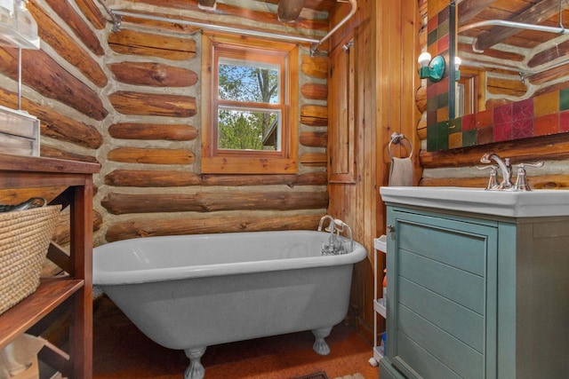 W3276 Princeton Rd, Green Lake, WI 54941 - bathroom with vanity, a freestanding tub, and rustic walls