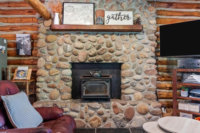 W3276 Princeton Rd, Green Lake, WI 54941 - detailed view of log walls and a wood stove