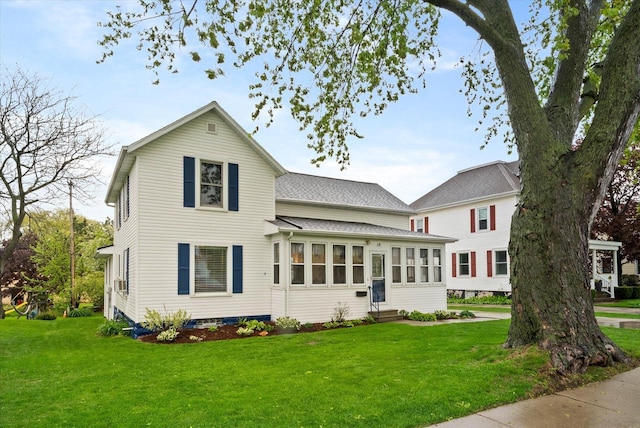 19 Hein Ave, Plymouth, WI 53073 - view of front of house with entry steps, a front yard, and a shingled roof