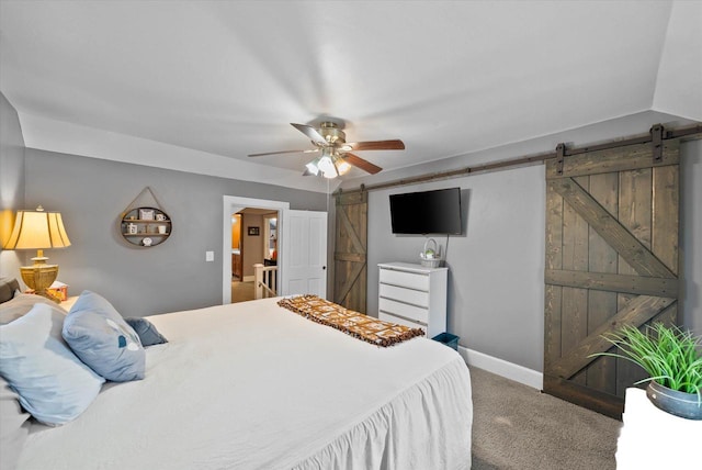 19 Hein Ave, Plymouth, WI 53073 - bedroom featuring a barn door, carpet flooring, baseboards, and a ceiling fan