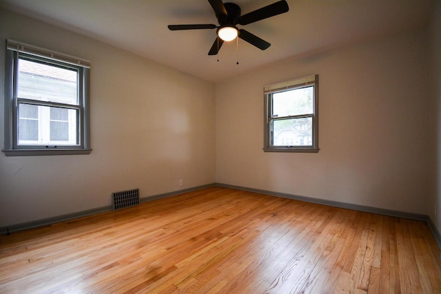 4407 N 57th St, Milwaukee, WI 53218 - spare room with light wood-style flooring, baseboards, and a ceiling fan