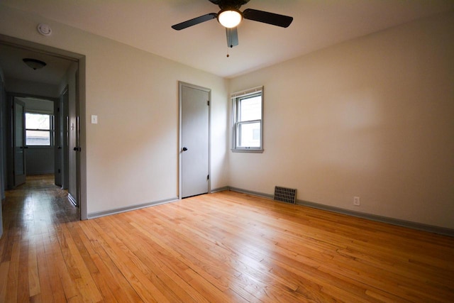 4407 N 57th St, Milwaukee, WI 53218 - unfurnished bedroom with light wood-style flooring, baseboards, and a ceiling fan