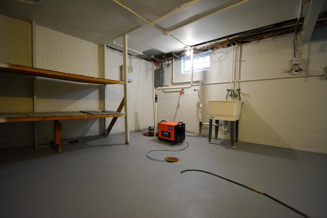 4407 N 57th St, Milwaukee, WI 53218 - below grade area featuring electric panel, concrete block wall, and a sink
