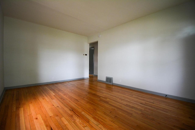 4407 N 57th St, Milwaukee, WI 53218 - empty room with hardwood / wood-style flooring and baseboards
