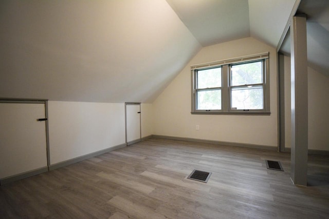 4407 N 57th St, Milwaukee, WI 53218 - bonus room featuring wood finished floors, baseboards, and vaulted ceiling