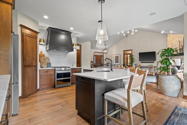 4021 Three Penny Ct, De Pere, WI 54115 - kitchen featuring appliances with stainless steel finishes, a sink, custom exhaust hood, light countertops, and tasteful backsplash