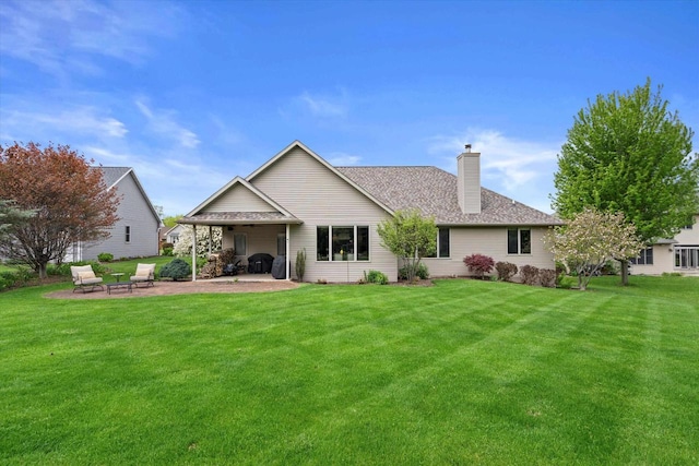 4021 Three Penny Ct, De Pere, WI 54115 - rear view of house featuring a patio, a chimney, a lawn, and roof with shingles