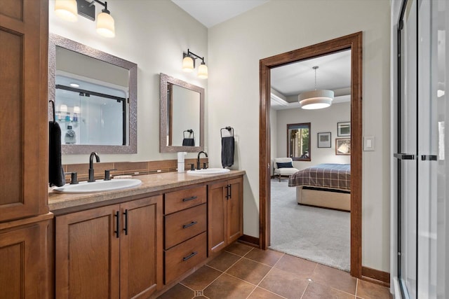 4021 Three Penny Ct, De Pere, WI 54115 - ensuite bathroom featuring double vanity, tile patterned flooring, baseboards, and a stall shower