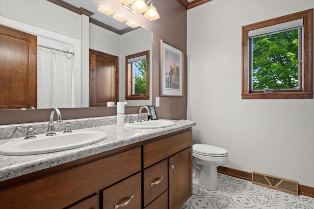 4021 Three Penny Ct, De Pere, WI 54115 - full bathroom with double vanity, plenty of natural light, toilet, and baseboards