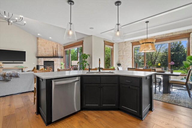 4021 Three Penny Ct, De Pere, WI 54115 - kitchen with dishwasher, a sink, light countertops, light wood finished floors, and lofted ceiling