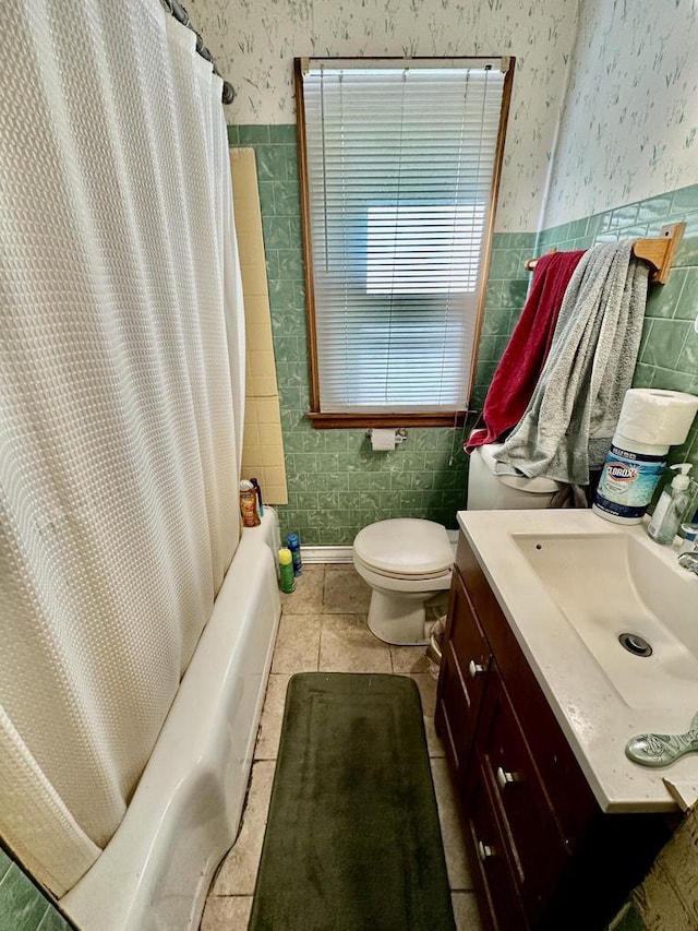 5501 W Thurston Ave, Milwaukee, WI 53218 - full bathroom with wallpapered walls, tile walls, vanity, a wainscoted wall, and shower / bath combination with curtain