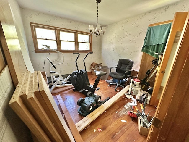 5501 W Thurston Ave, Milwaukee, WI 53218 - exercise area featuring wood-type flooring, a chandelier, and wallpapered walls