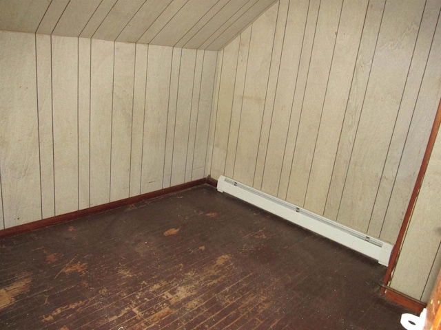 N4078 County Road A, Oxford, WI 53952 - additional living space featuring a baseboard radiator, wood walls, wood-type flooring, vaulted ceiling, and baseboards