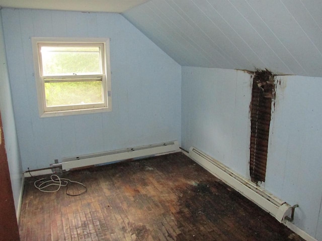 N4078 County Road A, Oxford, WI 53952 - additional living space with dark wood-style flooring, baseboard heating, vaulted ceiling, and a baseboard heating unit