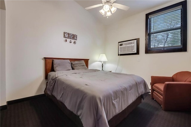 324 Douglas St, Chetek, WI 54728 - carpeted bedroom featuring a wall unit AC, vaulted ceiling, baseboards, and ceiling fan