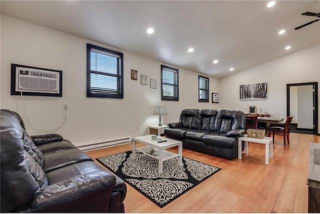 324 Douglas St, Chetek, WI 54728 - living area with a baseboard heating unit, a wall mounted AC, light wood finished floors, recessed lighting, and a ceiling fan