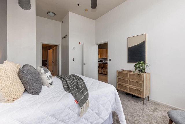1924 N Hubbard St Unit 208, Milwaukee, WI 53212 - bedroom featuring a towering ceiling, carpet, ceiling fan, and baseboards