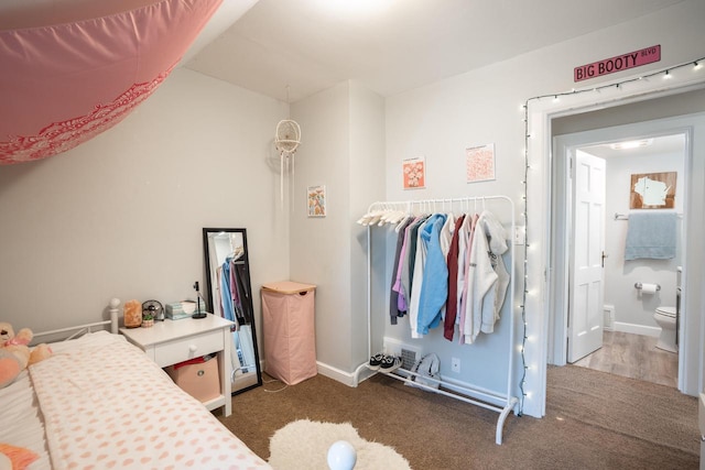 4781 N Idlewild Ave, Whitefish Bay, WI 53211 - carpeted bedroom with ensuite bath, baseboards, and lofted ceiling