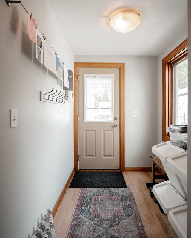4781 N Idlewild Ave, Whitefish Bay, WI 53211 - doorway to outside featuring light wood finished floors and baseboards